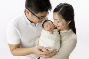 parents with newborn girl